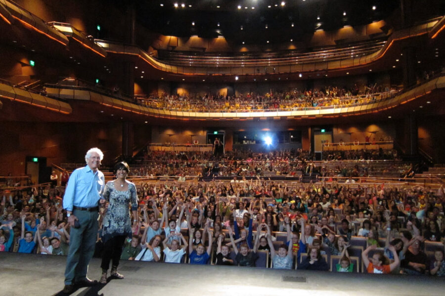 Jim and Jamie Dutcher presenting to a packed auditorium