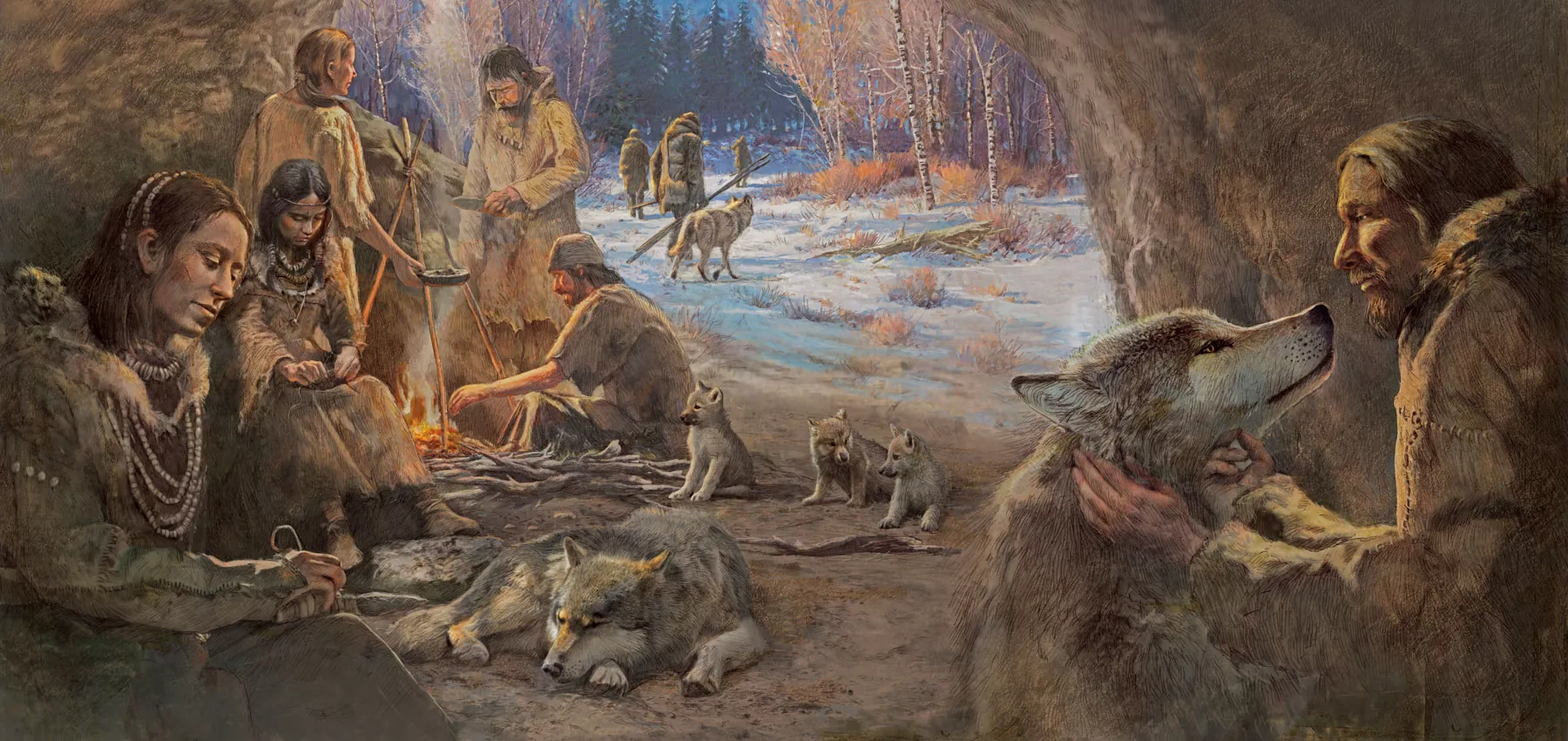 A prehistoric family in furs sits by a fire outside a cave, sharing food and warmth with wolves and pups—a scene reflecting ancient ways to give and form bonds. Snow blankets the trees, framing this display of connection and trust. | Living with Wolves