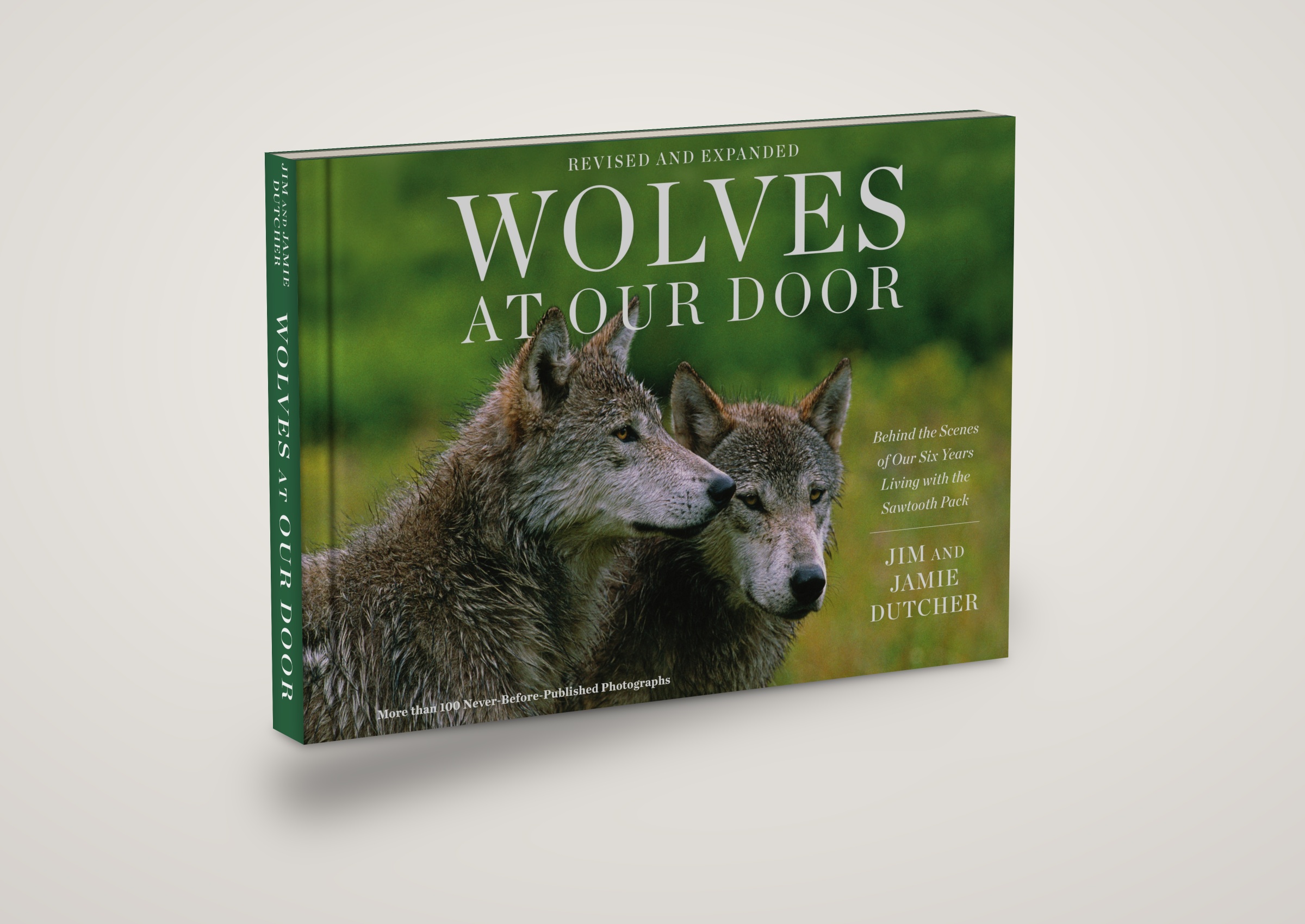 Hardcover product titled Wolves at Our Door: Behind the Scenes of Our Six Years Living with the Sawtooth Pack by Jim and Jamie Dutcher, featuring a photograph of two wolves on the cover. | Living with Wolves
